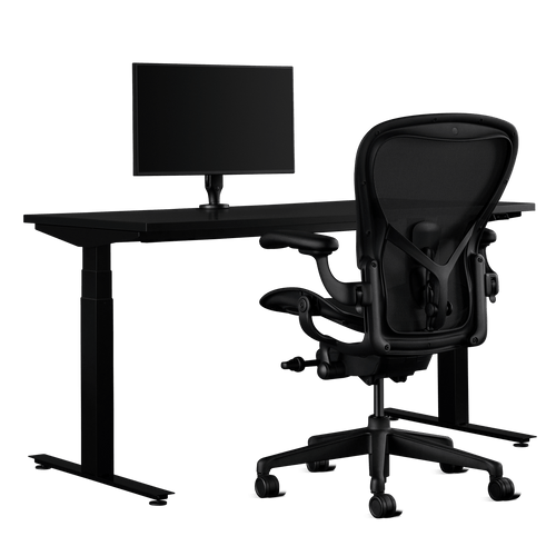 Side view of an Aeron Size C Onyx Gaming Chair, Nevi Gaming Desk and Ollin Monitor Arm from Herman Miller Gaming