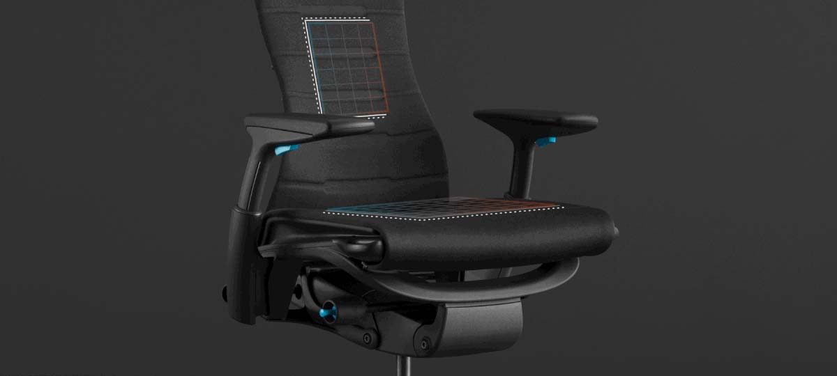 A red and blue animation of the enhanced seat on a photo of the Embody Gaming Chair on a black background.