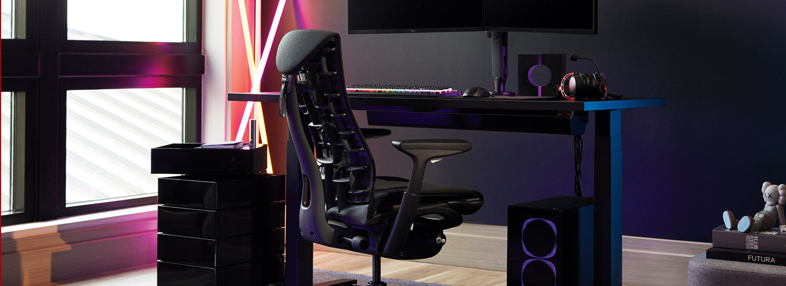 A Herman Miller Embody Gaming Chair as part of a setup featuring a Nevi sit-stand desk