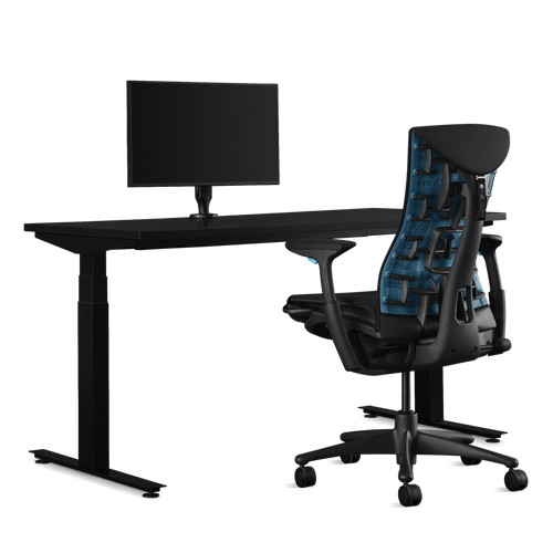 Side view of an Embody Cyan Gaming Chair, Nevi Gaming Desk and Ollin Monitor Arm from Herman Miller Gaming