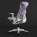 Angled view of the back of a purple and white Herman Miller X Logitech Embody gaming chair in Amethyst